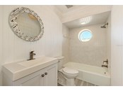 First floor Bathroom-right side - Single Family Home for sale at 949 Suncrest Ln, Englewood, FL 34223 - MLS Number is D6120396