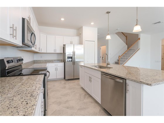 A chef's delight kitchen w/stainless steel appliances and granite countertops - Single Family Home for sale at 1837 East Isles Rd, Port Charlotte, FL 33953 - MLS Number is D6122330