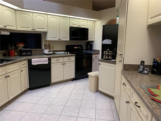Nice galley kitchen with eat in area - Single Family Home for sale at 4200 Swensson St, Port Charlotte, FL 33948 - MLS Number is C7452315