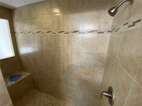 Master shower looking from entry.  Note the nice seat. - Single Family Home for sale at 4248 Kilpatrick St, Port Charlotte, FL 33948 - MLS Number is C7452734