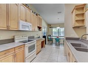 Kitchen with breakfast area - Single Family Home for sale at 1518 Bel Air Star Pkwy, Sarasota, FL 34240 - MLS Number is A4506654