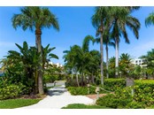 Tropical walk-way to the beach. - Condo for sale at 6810 Midnight Pass Rd, Sarasota, FL 34242 - MLS Number is A4507853