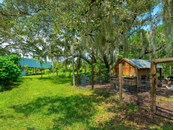 A home to many, the biodynamic farm hosts pigs, chickens, goats and fruit groves  where residents, livestock and crops flourish in ecological harmony. - Single Family Home for sale at Address Withheld, Bradenton, FL 34209 - MLS Number is A4509547