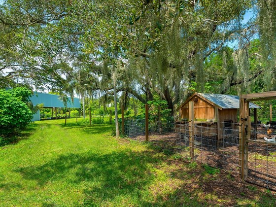 A home to many, the biodynamic farm hosts pigs, chickens, goats and fruit groves  where residents, livestock and crops flourish in ecological harmony. - Single Family Home for sale at Address Withheld, Bradenton, FL 34209 - MLS Number is A4509547
