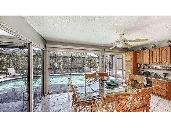 Dining room with a pool view - Single Family Home for sale at 373 Avenida Madera, Sarasota, FL 34242 - MLS Number is A4510043