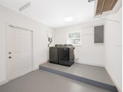 The garage is spotless and includes a full-size Samsung washer & dryer, plus a tankless water heater. - Single Family Home for sale at 3070 Hatton St, Sarasota, FL 34237 - MLS Number is A4518301