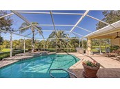 Heated pool with tiered water feature - overlooking the lake. - Single Family Home for sale at 8821 Misty Creek Dr, Sarasota, FL 34241 - MLS Number is A4521942