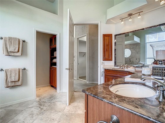 Water closet has a pocket door with a timer. timer in water closet can be used as a heat lamp as well with the right bulb add if desired. - Single Family Home for sale at 319 Stone Briar Creek Dr, Venice, FL 34292 - MLS Number is A4522164