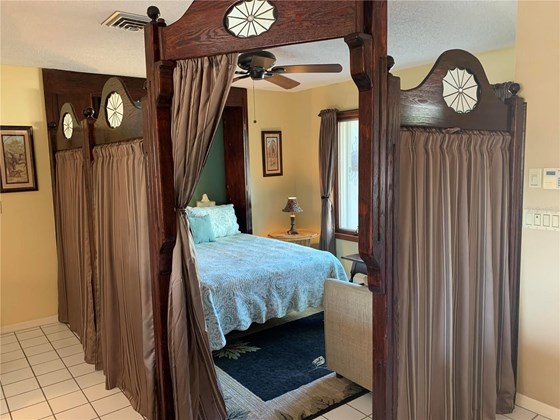 murphy bed pulled down with dividers up for privacy. The perfect Casaba - Single Family Home for sale at 10 Pine Ridge Way, Englewood, FL 34223 - MLS Number is N6118641