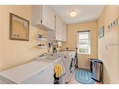 Large inside laundry room - Single Family Home for sale at 10 Pine Ridge Way, Englewood, FL 34223 - MLS Number is N6118641
